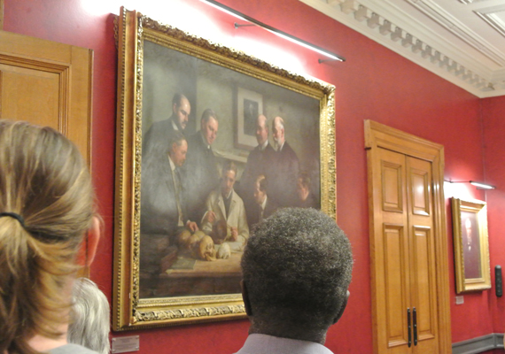 Visitors enjoy viewing 'Discussion on the Piltdown Skull' in the Society's Council Room